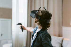 Gamer wearing VR headset connected to cloud gaming, merging VR technology with cloud gaming trends.